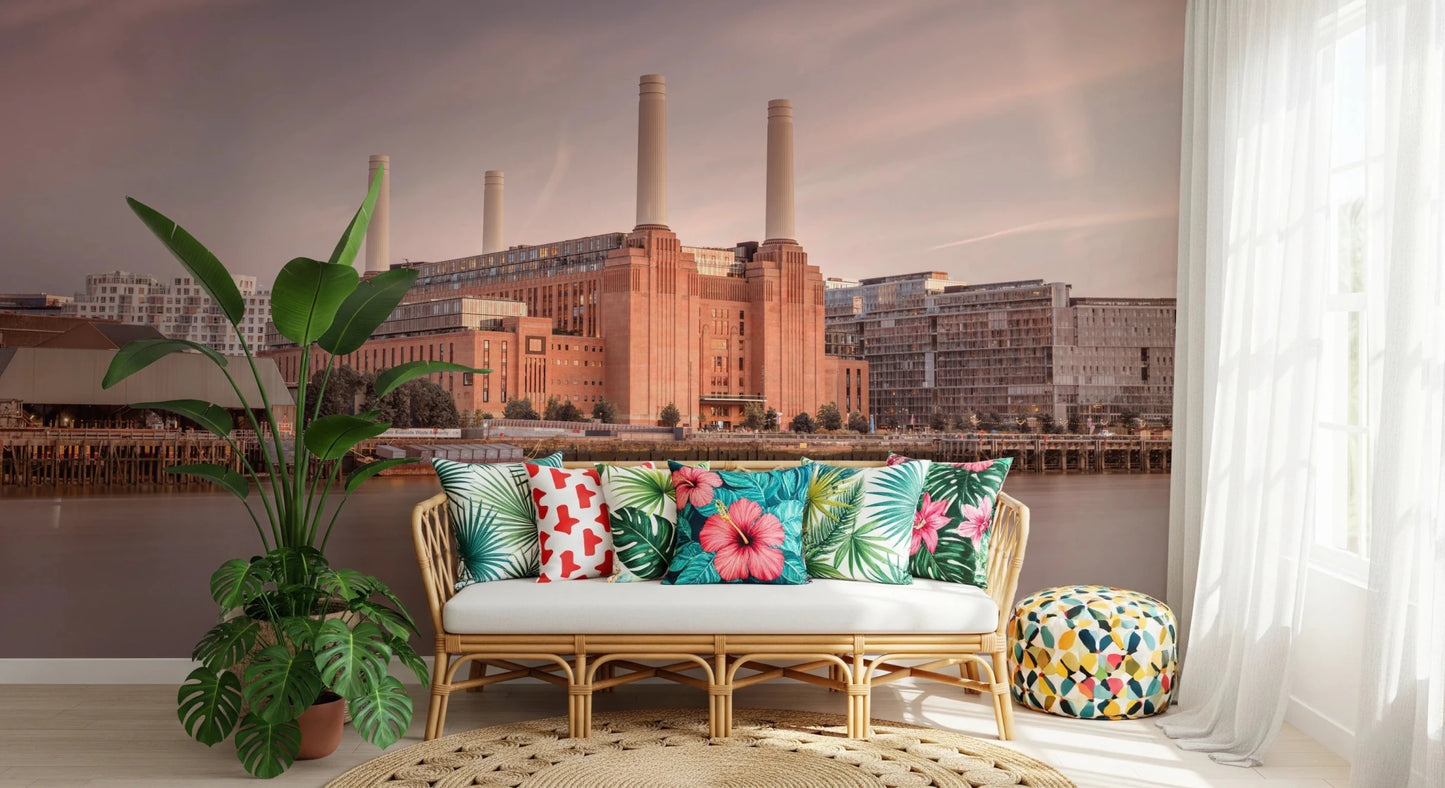 Skyline view of Battersea Power Station wall mural in soft sunset light.