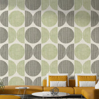 A graceful subtle circle wall mural in cool, sage tones.

