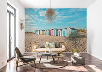 Modern apartment wall mural showing a row of colorful cabins.