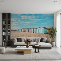 Beach Huts on the Shore Wall Mural with light clouds above.