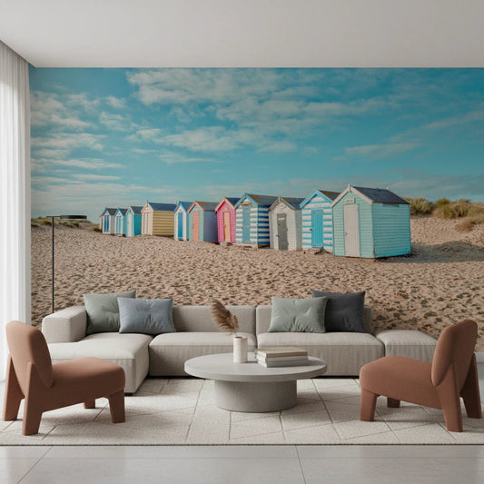 Colorful Beach Huts on the Shore living room Wall Mural with blue sky.