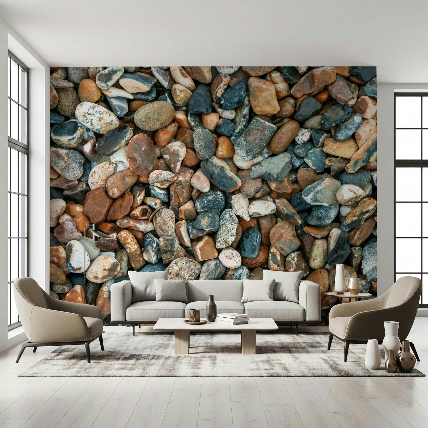 Beach pebble wall mural above grey couch