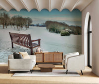 Rustic Bench in a Snowy Landscape wallpaper, bare trees, cold weather design.