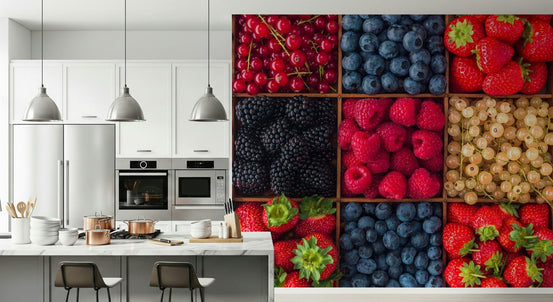 Berry Fresh Delight wallpaper mural of mixed berries in wooden boxes beside a white kitchen island with copper pots