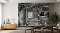 Rustic storefront scene featuring a classic bicycle and Cafe wall mural
