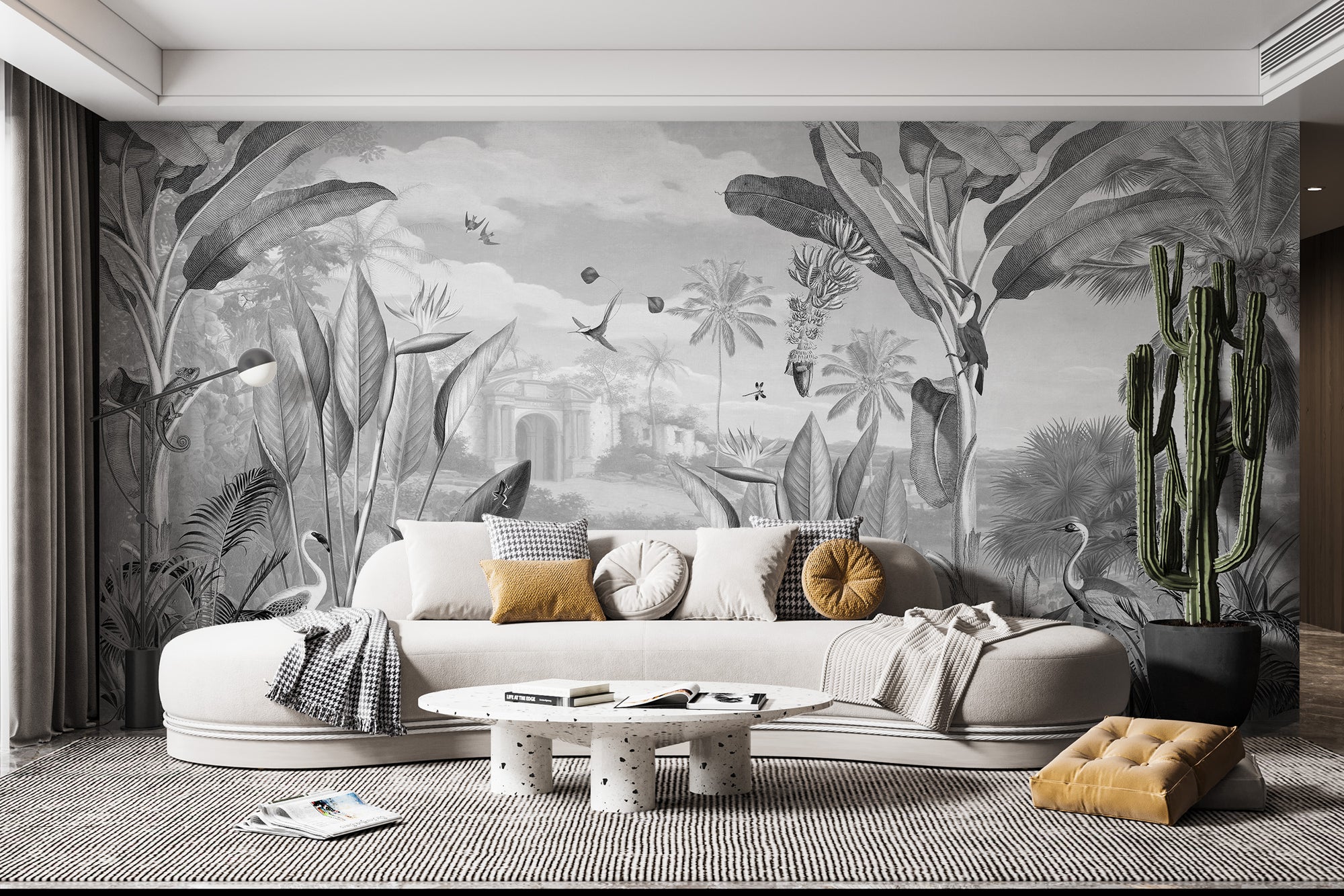 Black and White Forest Mansion wallpaper behind a cream curved sofa with a tall green cactus in a living room