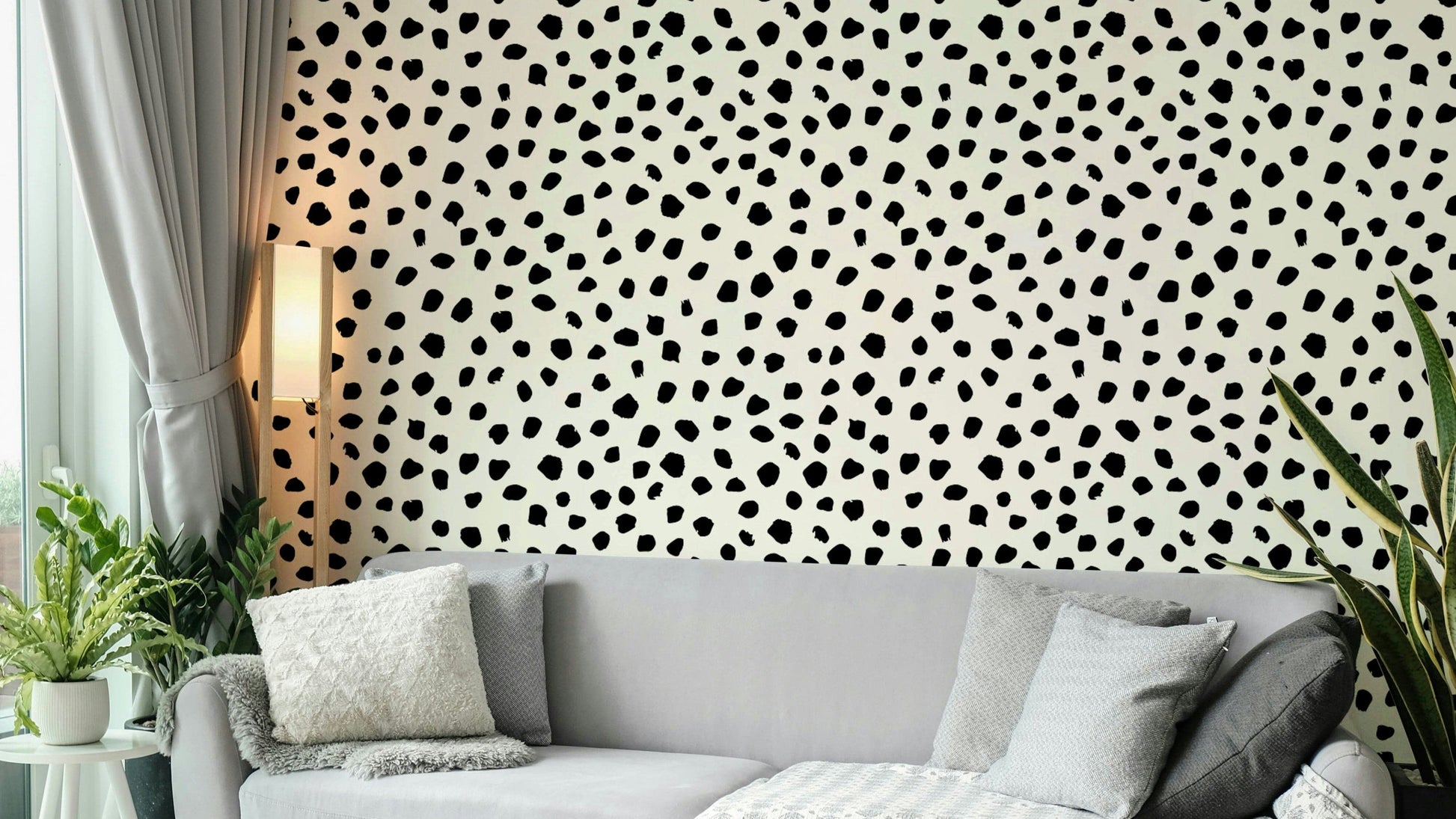 Chic black polka dot wallpaper with a hand-painted feeling.
