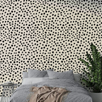 Irregular monochrome dots style wallpaper for a sleeping room.
