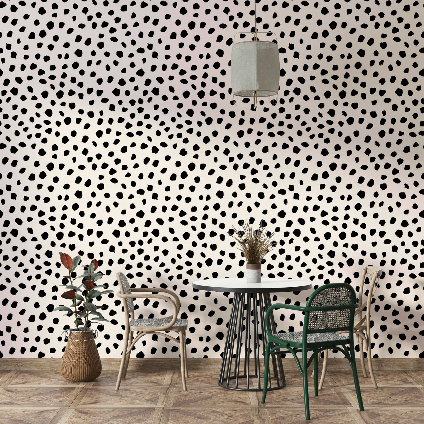 Hand-drawn black ink spots on cream wallpaper for a nursery.
