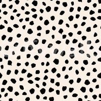 Artistic black dot wallpaper adds texture to any small room.
