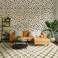 Bold abstract ink blot wallpaper for a contemporary hallway.
