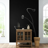 A detailed shot of the delicate leaves and stem against a vibrant background.

