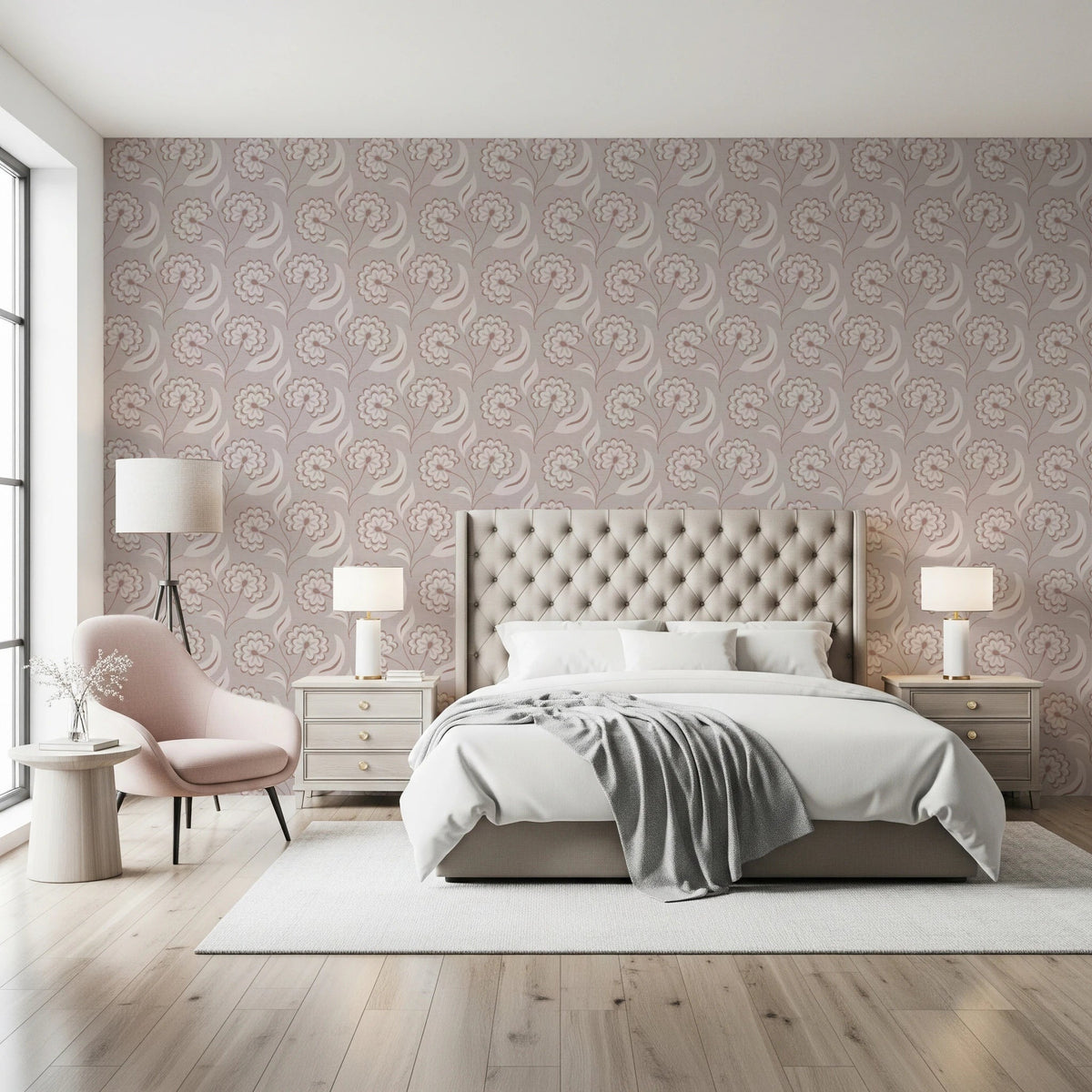 Bloomscape Beige wallpaper in dusty-pink blooms behind a tufted cream headboard with a pink accent chair in a bedroom