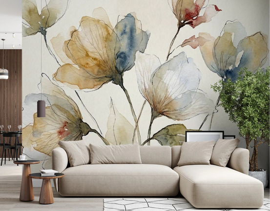 Bloomscape wallpaper mural of muted ochre and blue watercolor flowers behind a beige sectional sofa in a living room