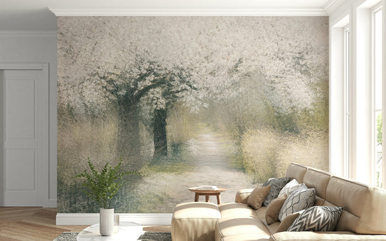 Blossom Trail wallpaper mural of a white blossom tree over a misty path behind a tan sectional sofa