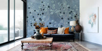 Indigo floral mural in a flat lounge, modern feature wall depth