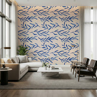 Nature-inspired wallpaper with blue flowers and leafy botanical elements.