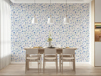 Azure Bloom Garden Wallpaper as a feature wall in a contemporary dining room.