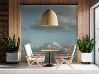 Light blue sky wall mural creates an airy atmosphere.