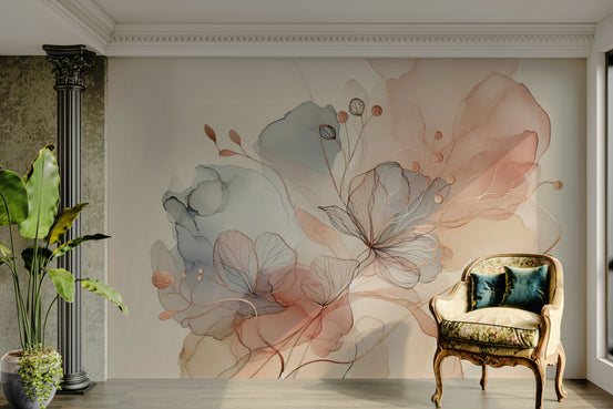 Blush Botanical Dream wallpaper mural with pink and blue watercolor flowers behind a black column and gold armchair