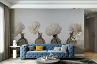 The vases are placed on a light, textured wooden surface against a simple, neutral background.

