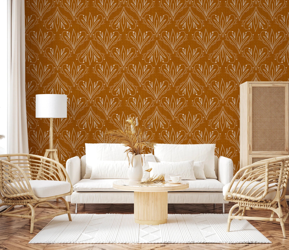 Boho Art Nouveau Folk Floral Mustard Gold wallpaper behind a white sofa and rattan armchairs in a living room