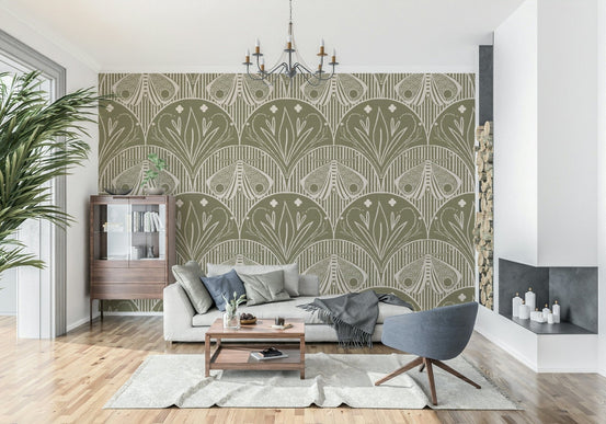 Boho Art Nouveau Scallop Butterfly Floral in Olive Drab wallpaper behind a grey sofa and chandelier in a living room