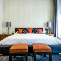 Harlequin pattern wallpaper in soft blue

