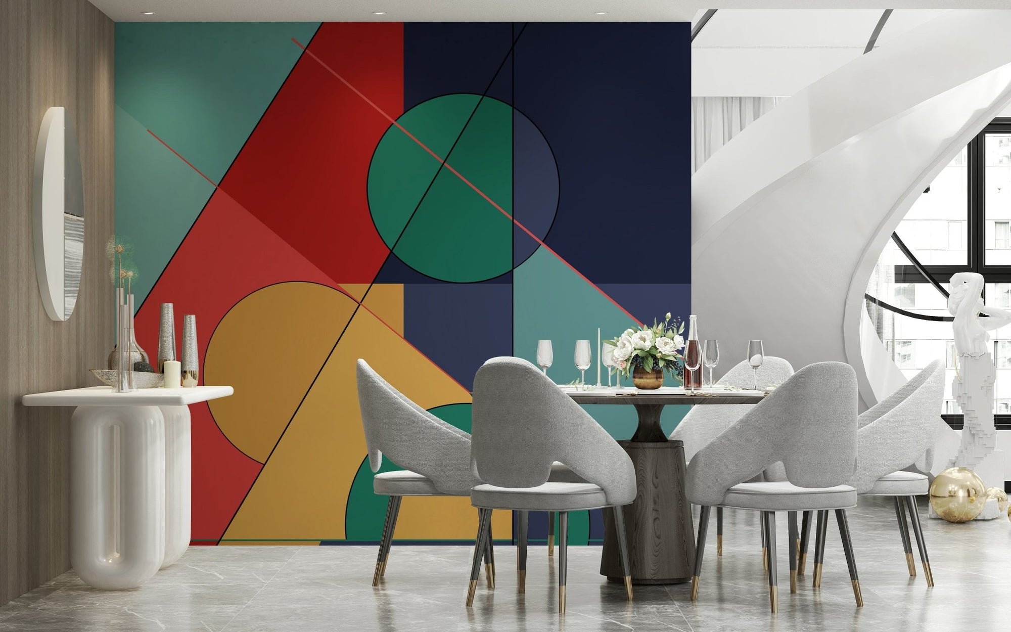 Bold Bauhaus wallpaper mural of red, teal and navy geometric shapes behind a round dining table and grey chairs