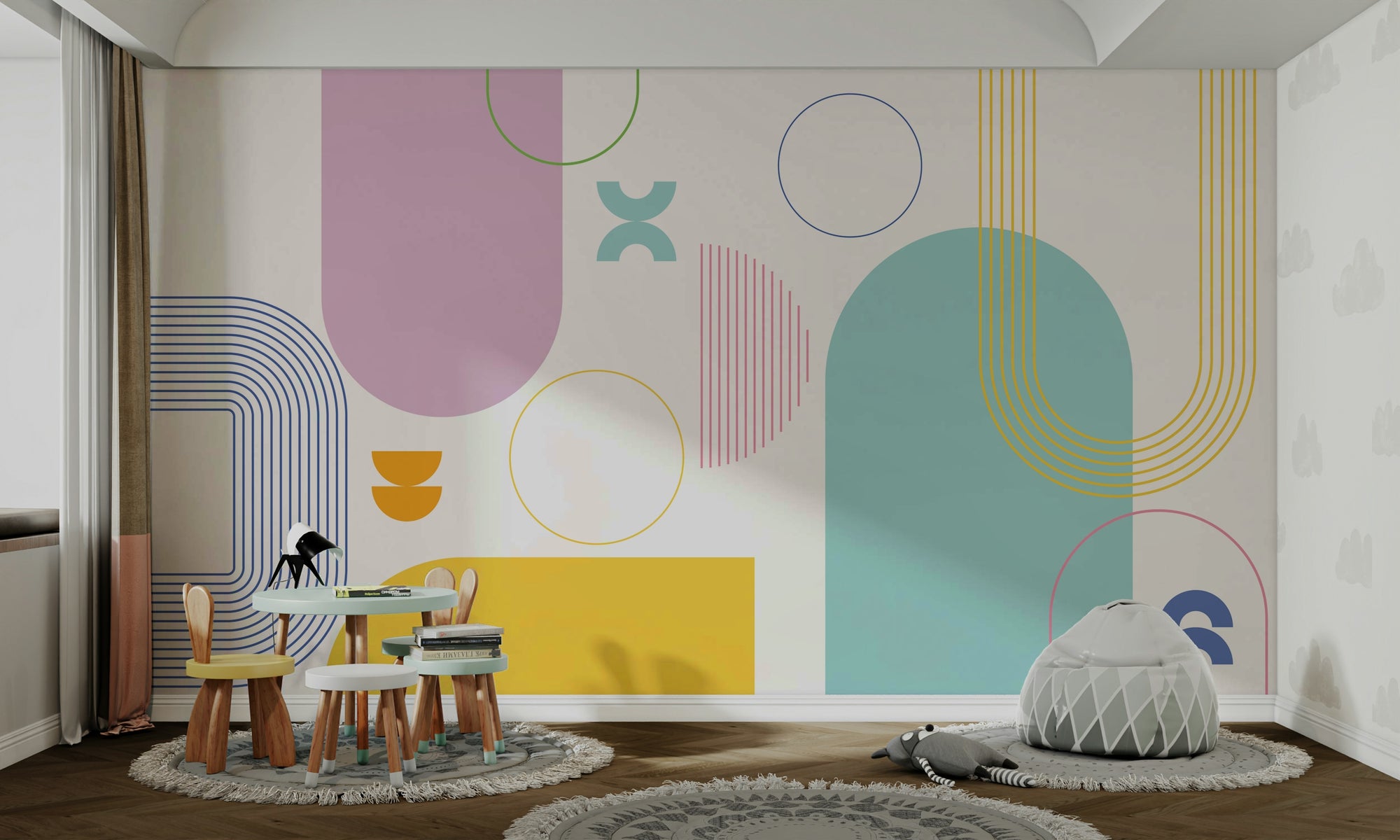 Bold Minimalist Geometric mural in pastel pink and teal shapes behind a wooden kids table in a children playroom