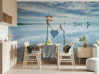Artistic heart sculpture Bound by Love mural wide beach view.