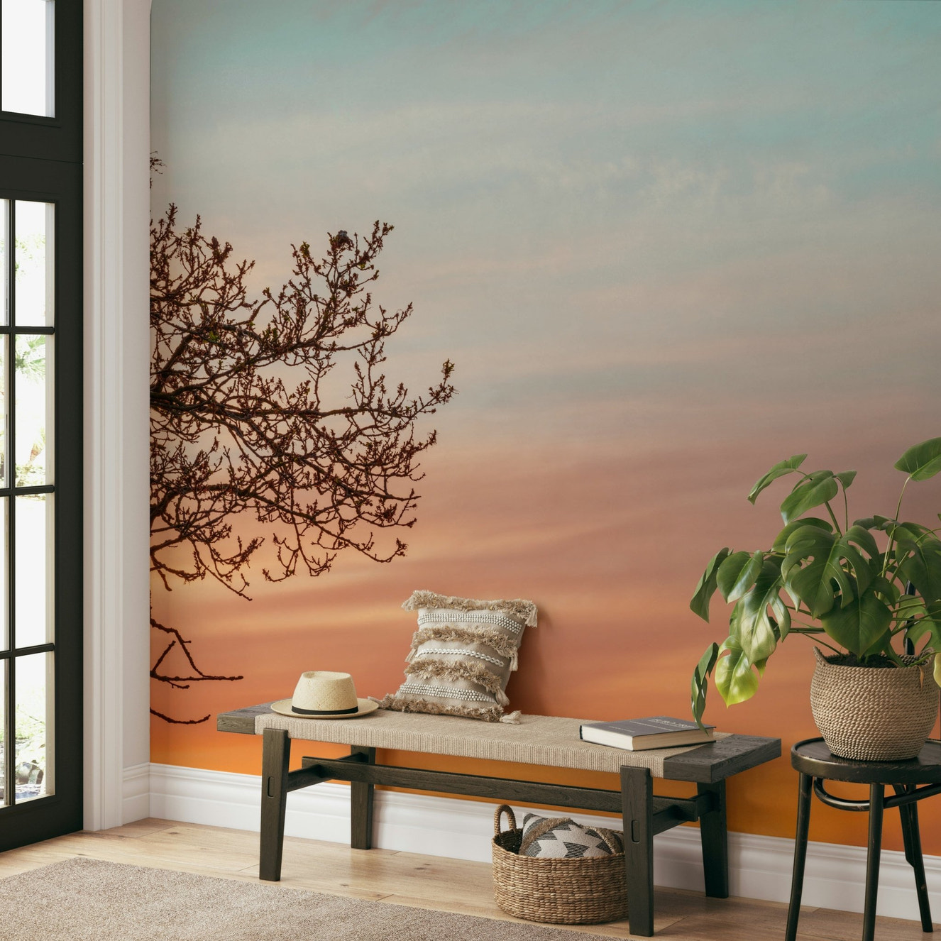 Mural with warm sunset hues and branch outline

