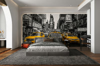 Yellow taxis adding a pop of color to the black-and-white background

