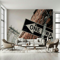 Decorative wall mural showcasing a bustling Brooklyn street with “One Way” signage.