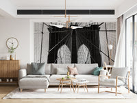 Brooklyn bridge cable mural in reading nook, cosy chair styling, grey-toned wall backdrop