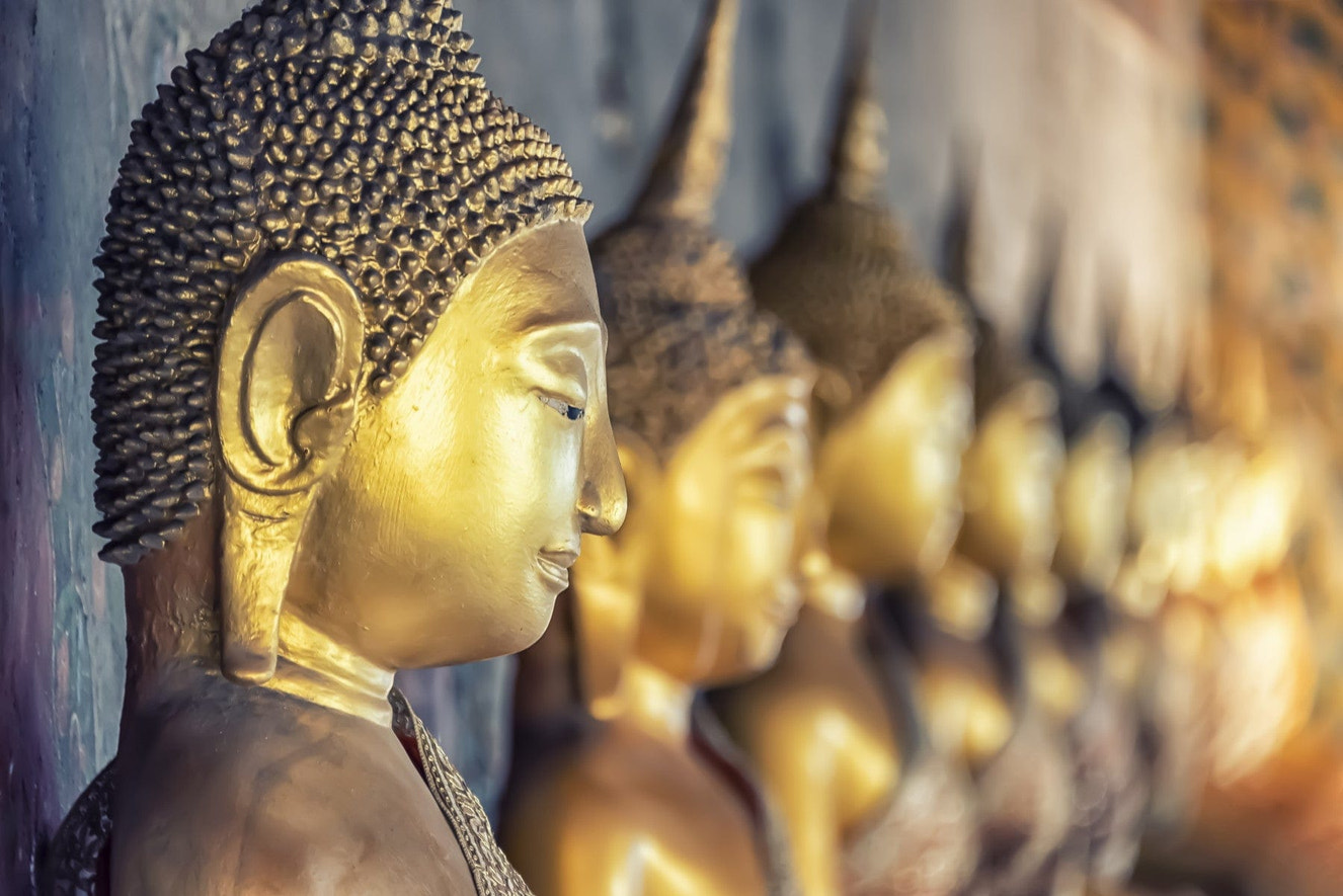 Spiritual statue wallpaper for a minimalist apartment bedroom feature wall.