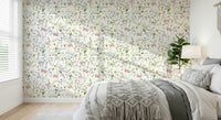 Spring meadow floral wallpaper in gentle pastel shades