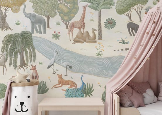 Safari Whispers wallpaper mural with a soft savanna of elephant and giraffe beside a dusty-pink canopy bed and bear laundry bag