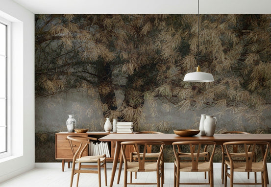 Whispering Pines wallpaper mural with misty brown pine boughs behind a wood dining table and wishbone chairs
