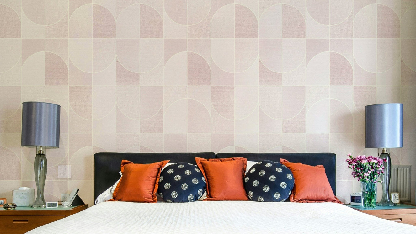 Blush pink geometric tile pattern.

