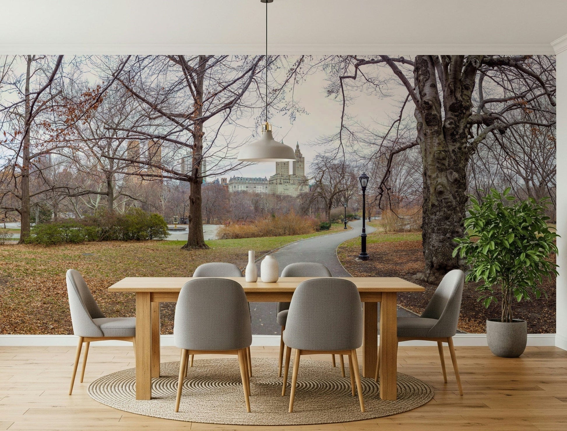 Cityscape with foliage mural on hallway feature wall, modern apartment decor, soft greens
