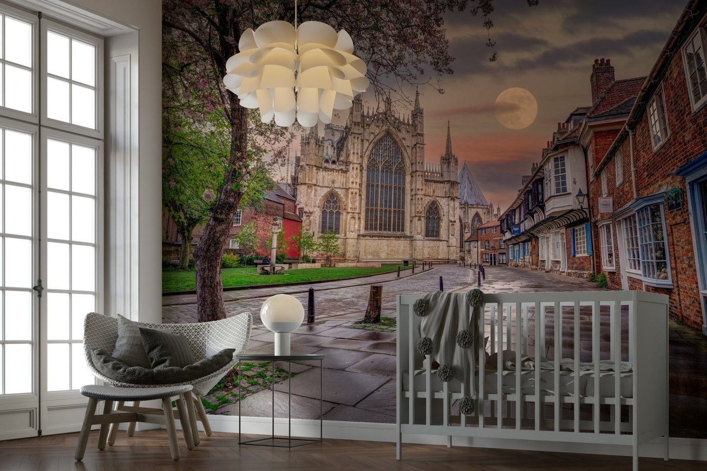 A tree with some spring blossoms is visible in the foreground.
