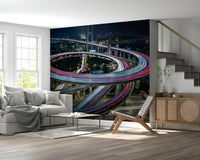 Modern Urban Light Trail Wallpaper – Night city skyline with flowing streaks of colorful lights for a dramatic effect.