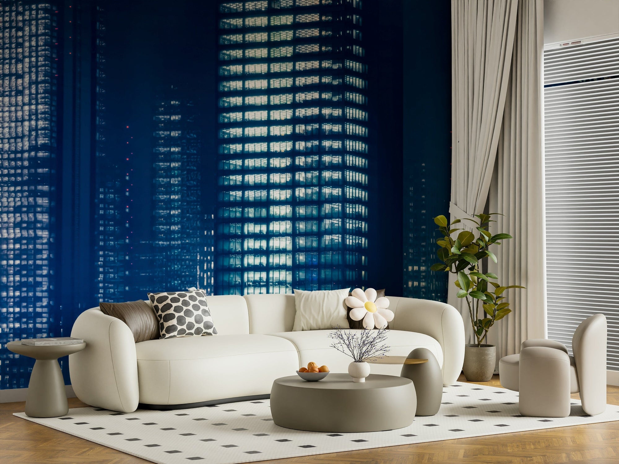 City Lightscape wallpaper mural of navy blue lit skyscrapers at night behind a cream curved sofa in a living room