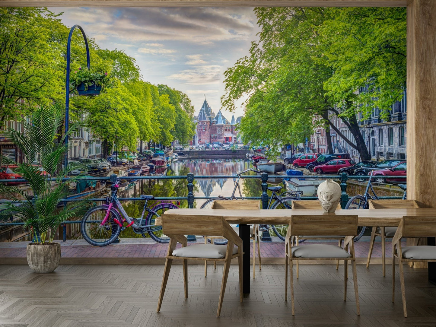 Dining room wall featuring a green canal mural.

