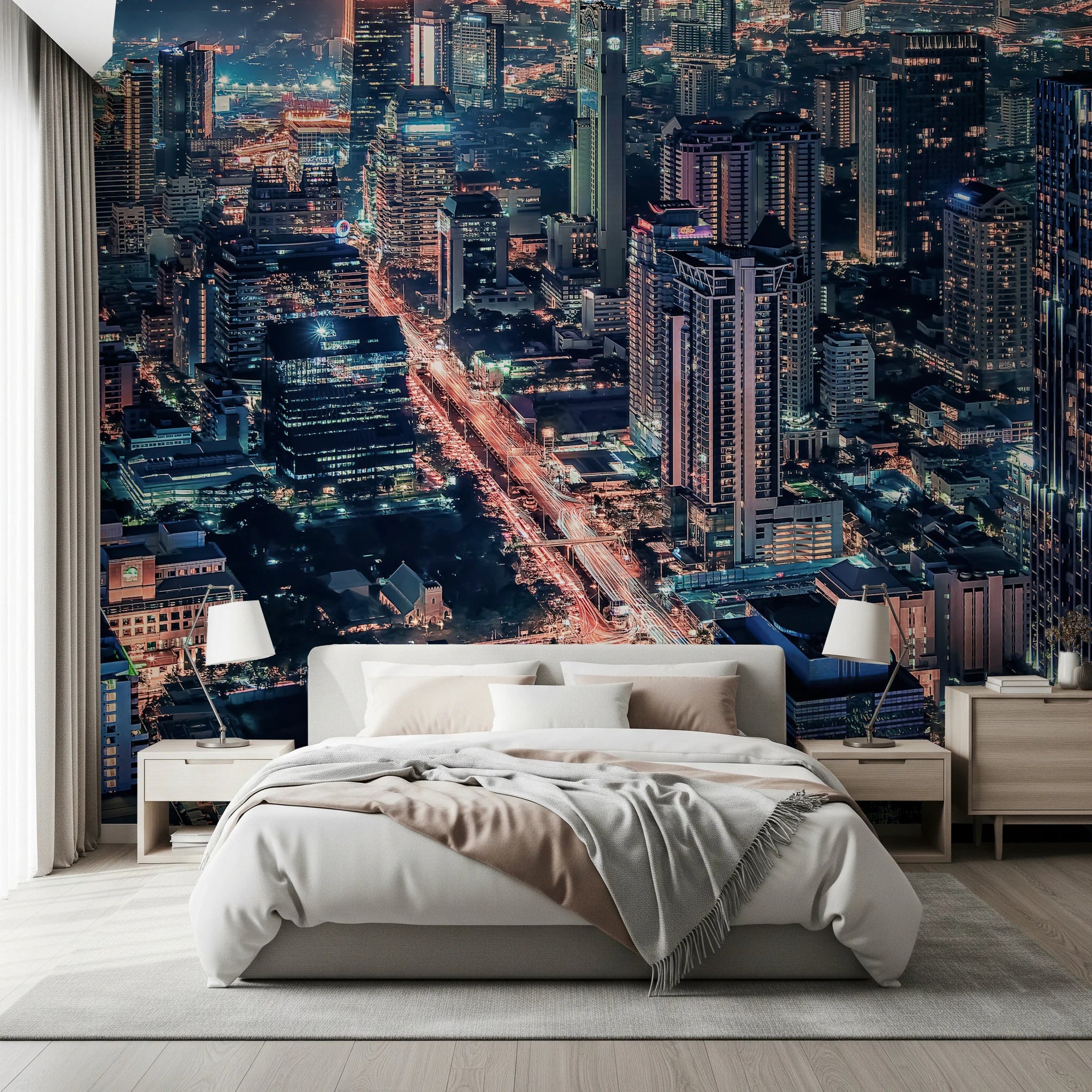 Cityscape Night wallpaper mural with aerial city skyline and glowing streets behind a white bed in a bedroom
