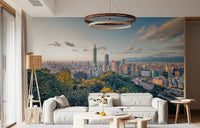 Cityscape Vista wallpaper mural of the Taipei 101 skyline at sunset above a white sofa and rattan floor lamp