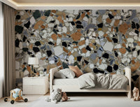 Gorgeous Terrazzo shard wallpaper features black, white, and rust stone.
