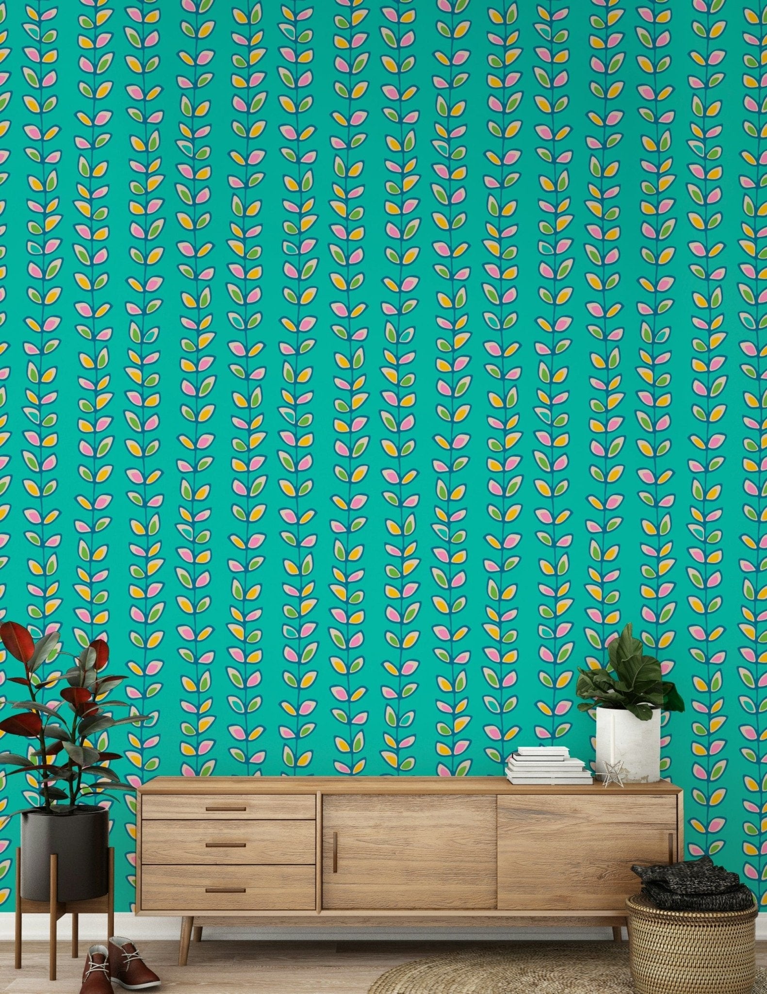 Bright turquoise wallpaper decorated with evenly spaced retro leaves in pink, yellow, and green tones.