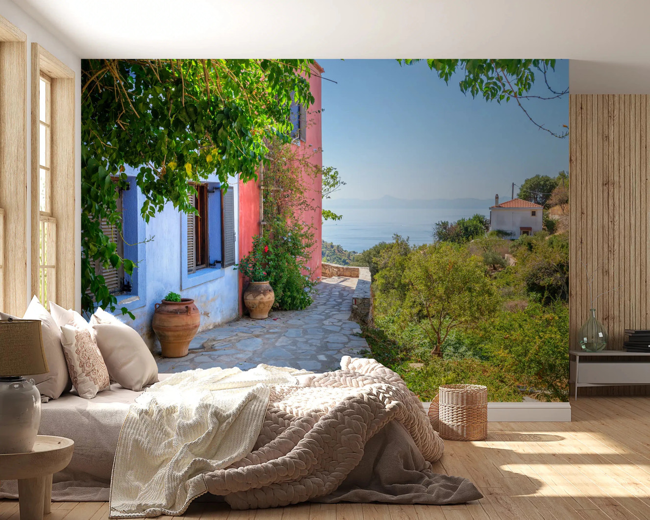 Coastal Path Charm Wall Mural with pink and blue houses near the sea.